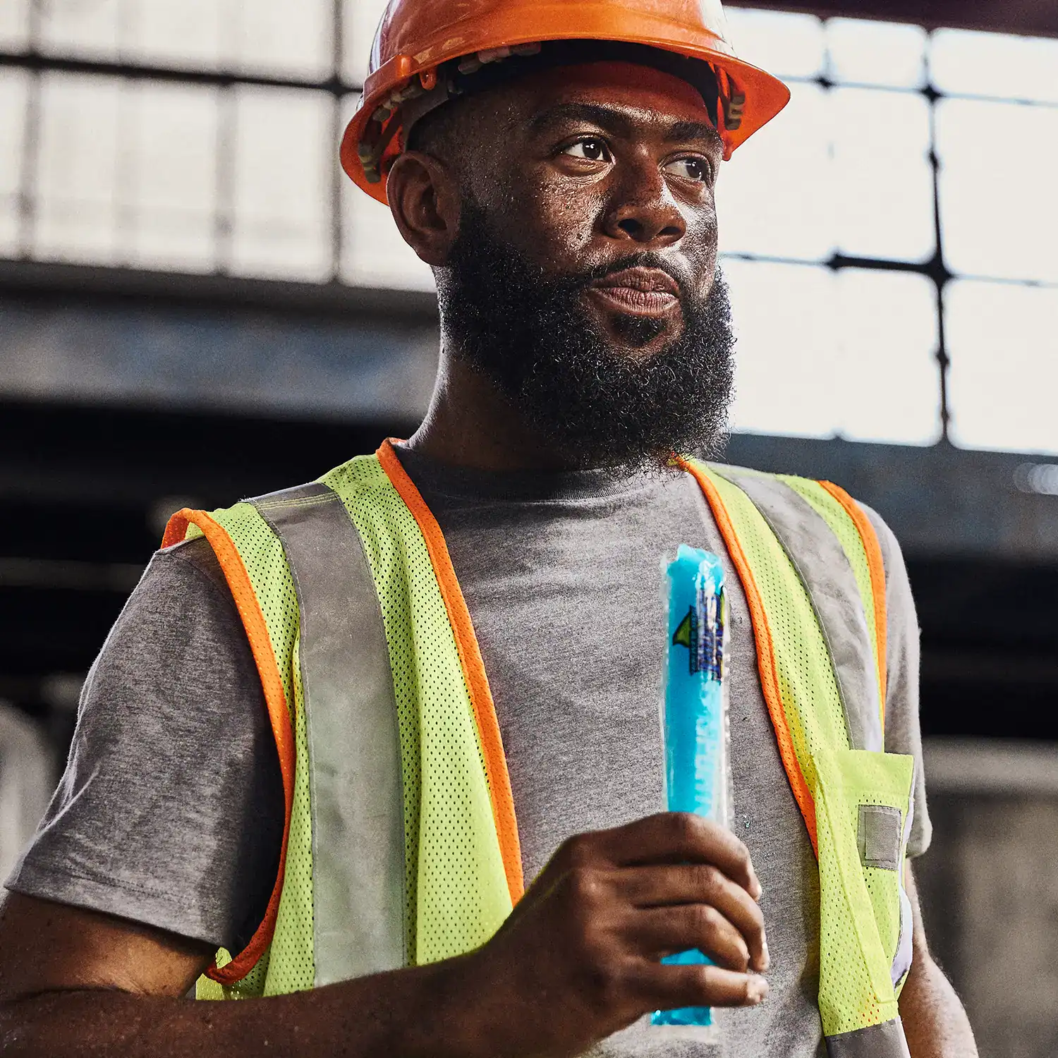 Construction worker enjoying All Sport Freezer Pops Blue Raz Ice
